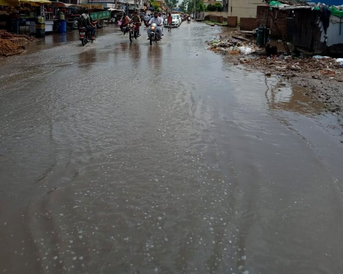 water filled under railway bridge, people upset