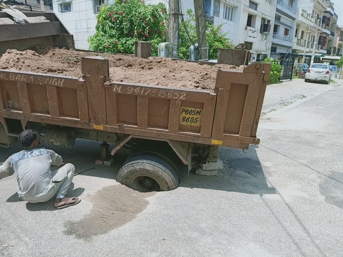 Truck stuck due to road sinking in phase-five