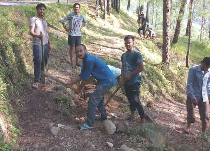 Villagers of Simalta raised picks and shovels to build roads