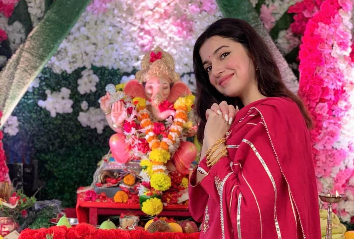 bhushan kumar divya khosla celebrate ganesh utsav wear red lehariya sharara