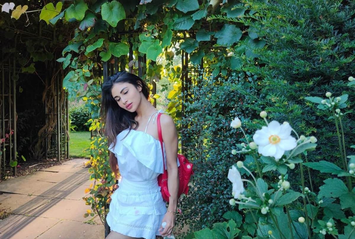 mouni roy flaunt her perfect figure in floral crop top & mini skirt