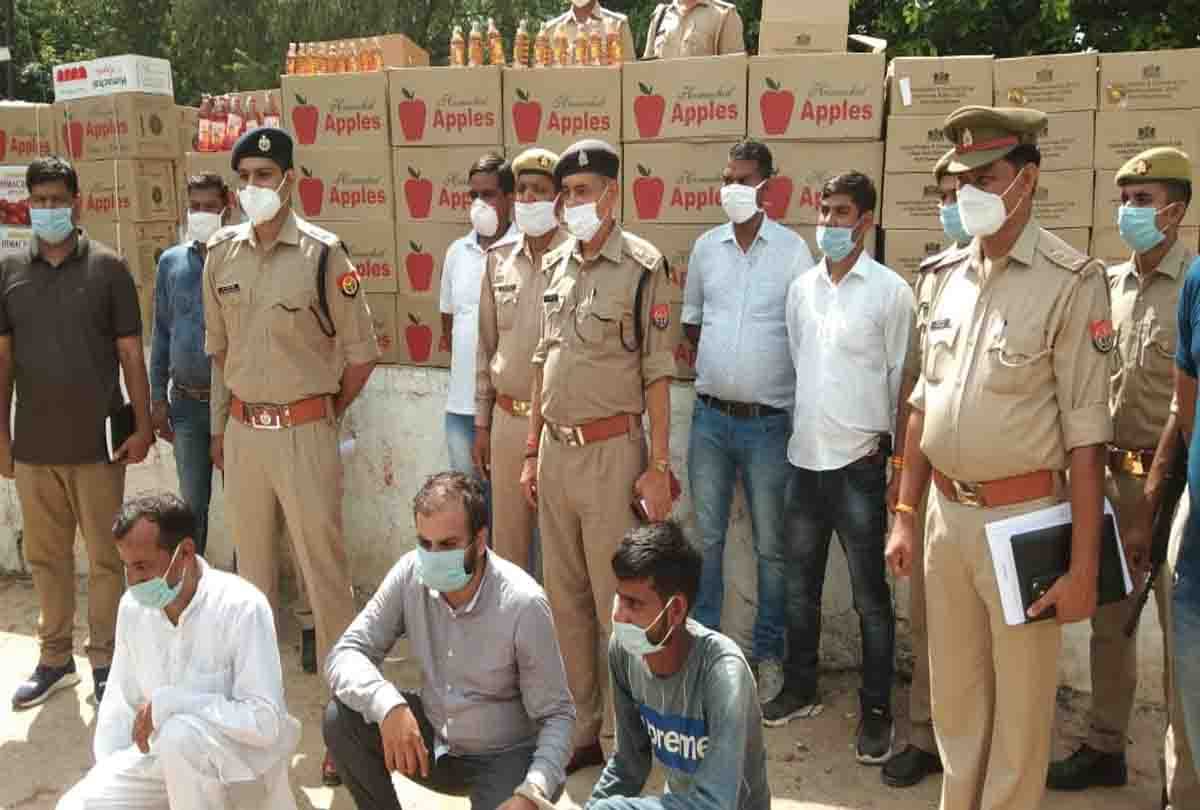 Alcohol found in apple boxes, three caught