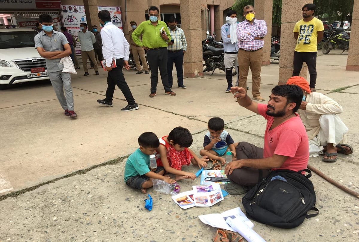 Gautam budh nagar dm suhas ly sat on road and hear complaint of a complainant photos goes viral