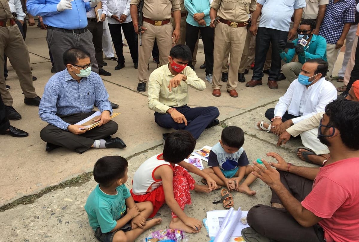 Gautam budh nagar dm suhas ly sat on road and hear complaint of a complainant photos goes viral