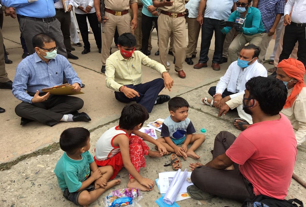 Gautam budh nagar dm suhas ly sat on road and hear complaint of a complainant photos goes viral