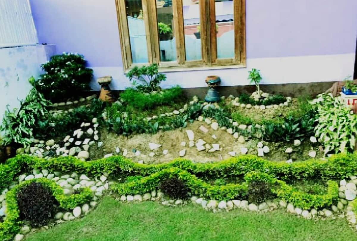 Doctor Arun Rai and Vishwamitra Bhatt serving nature gardening made rock garden in lawn