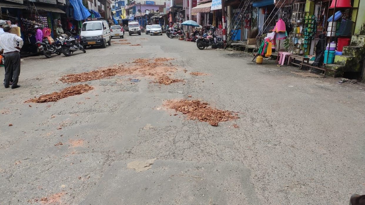Pits filled with red soil in Garuda