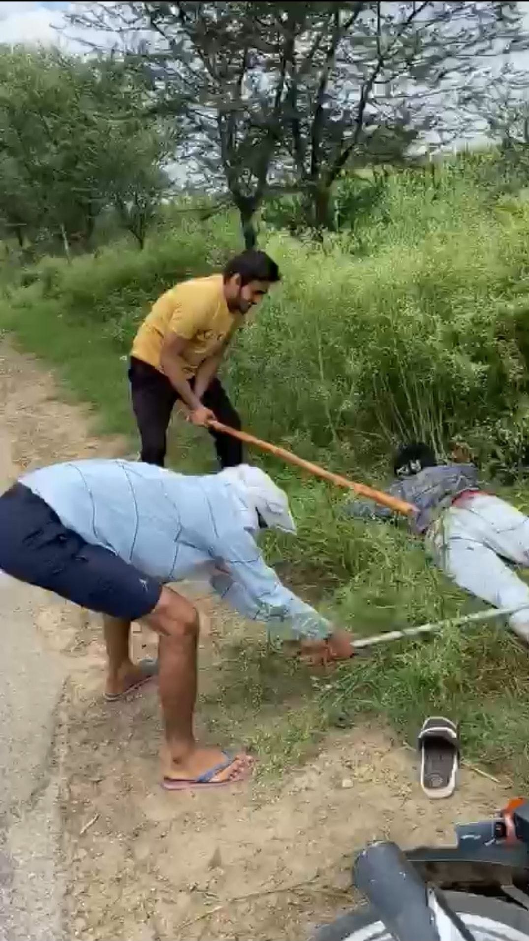 The video of a young man being beaten with an iron rod and sticks has viral