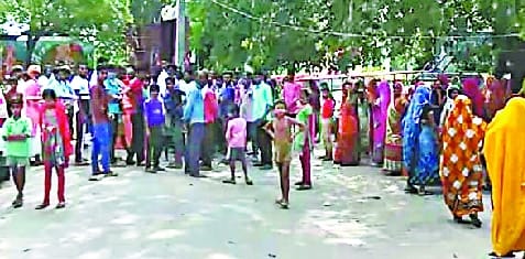 Demonstration at the opening of liquor shop near the temple in Barkaliganj