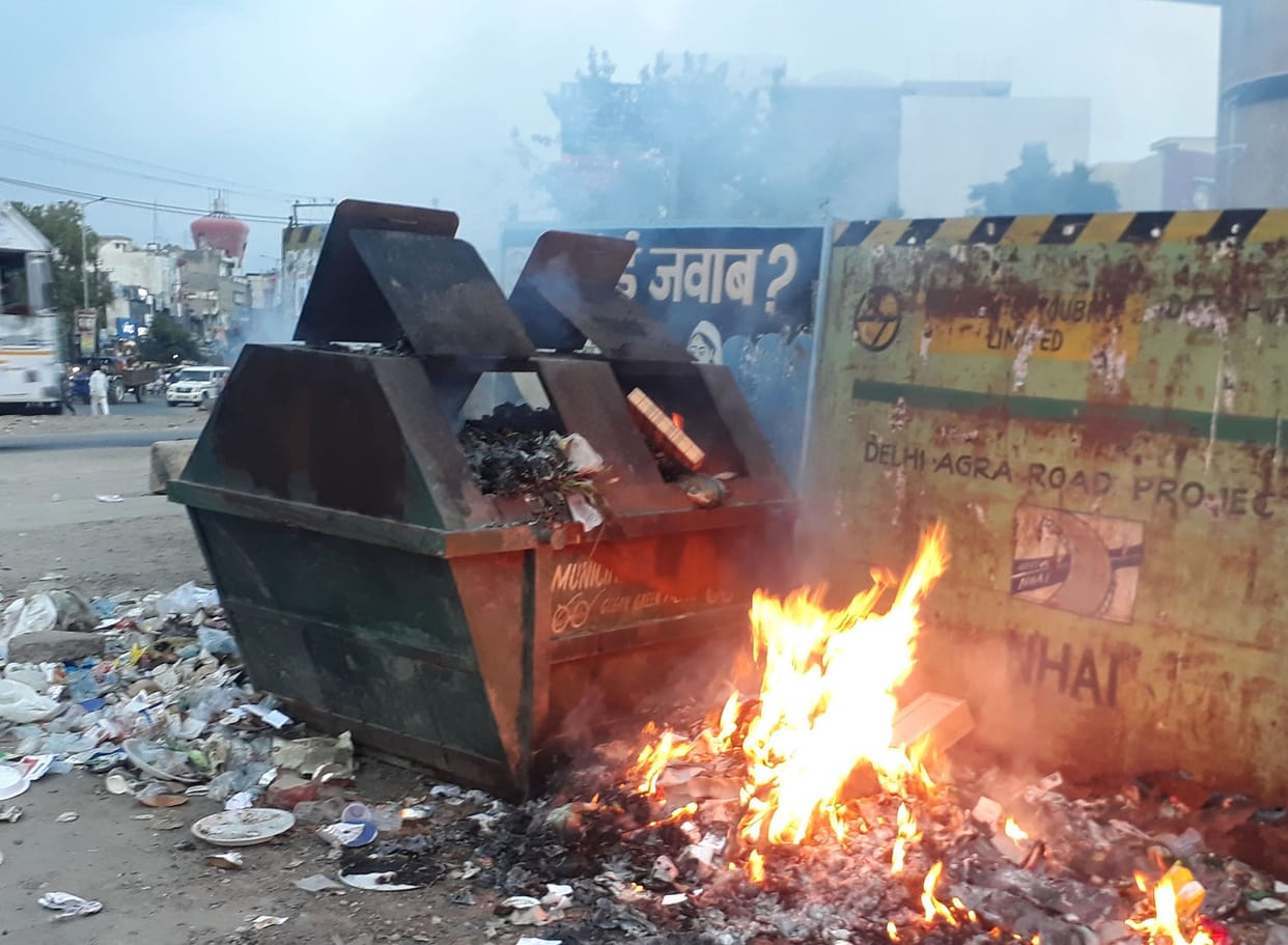 litter is on fire , officer unaware