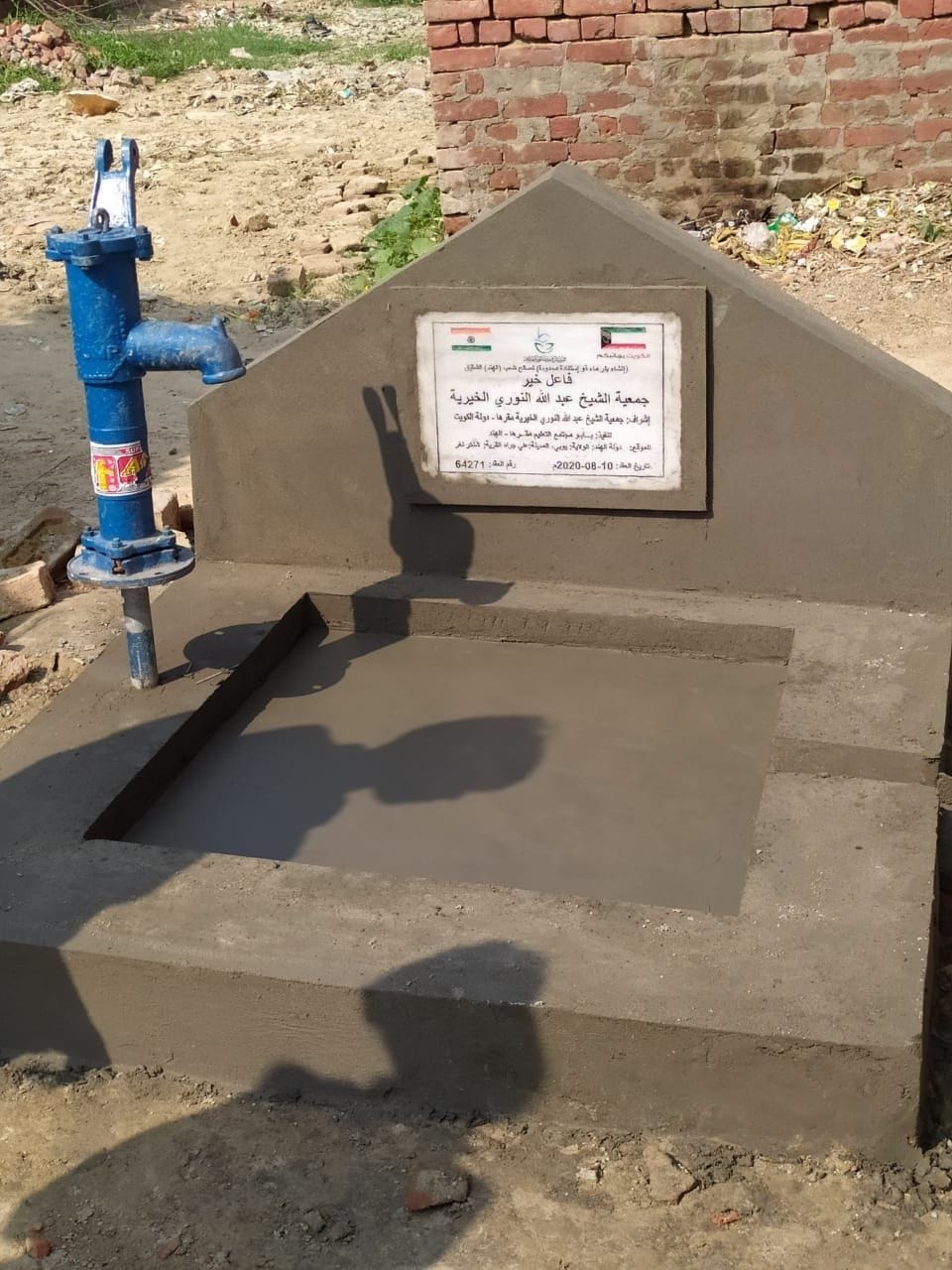 Picture of foreign flag with tricolor on inscription of hand pump, outrage