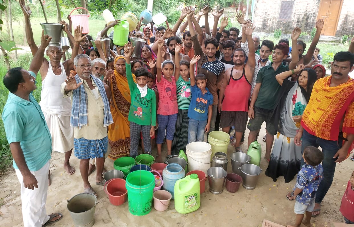 Villagers protested with a bucket for water