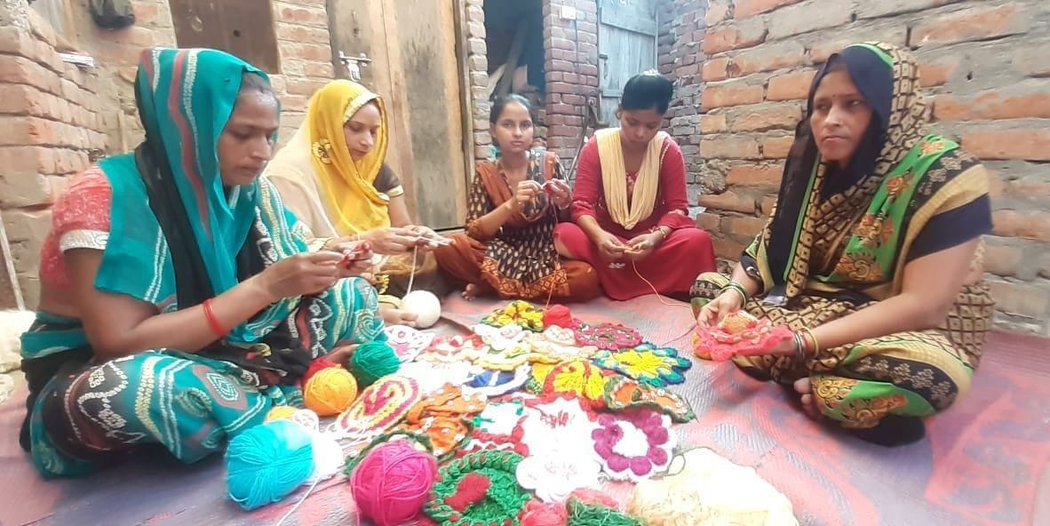 Women Stiching dress in disaster time