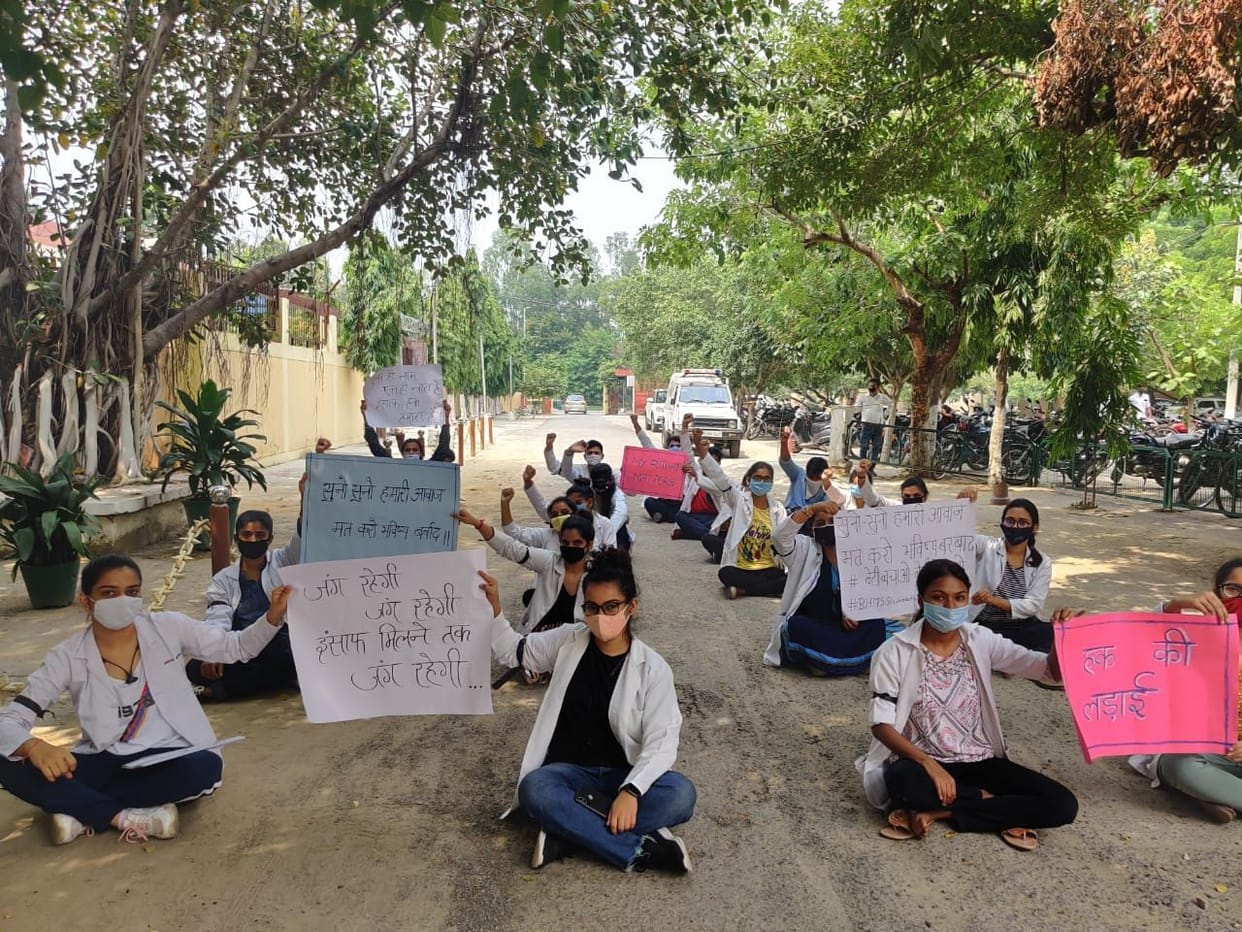 Homeopathy students sit on VC office
