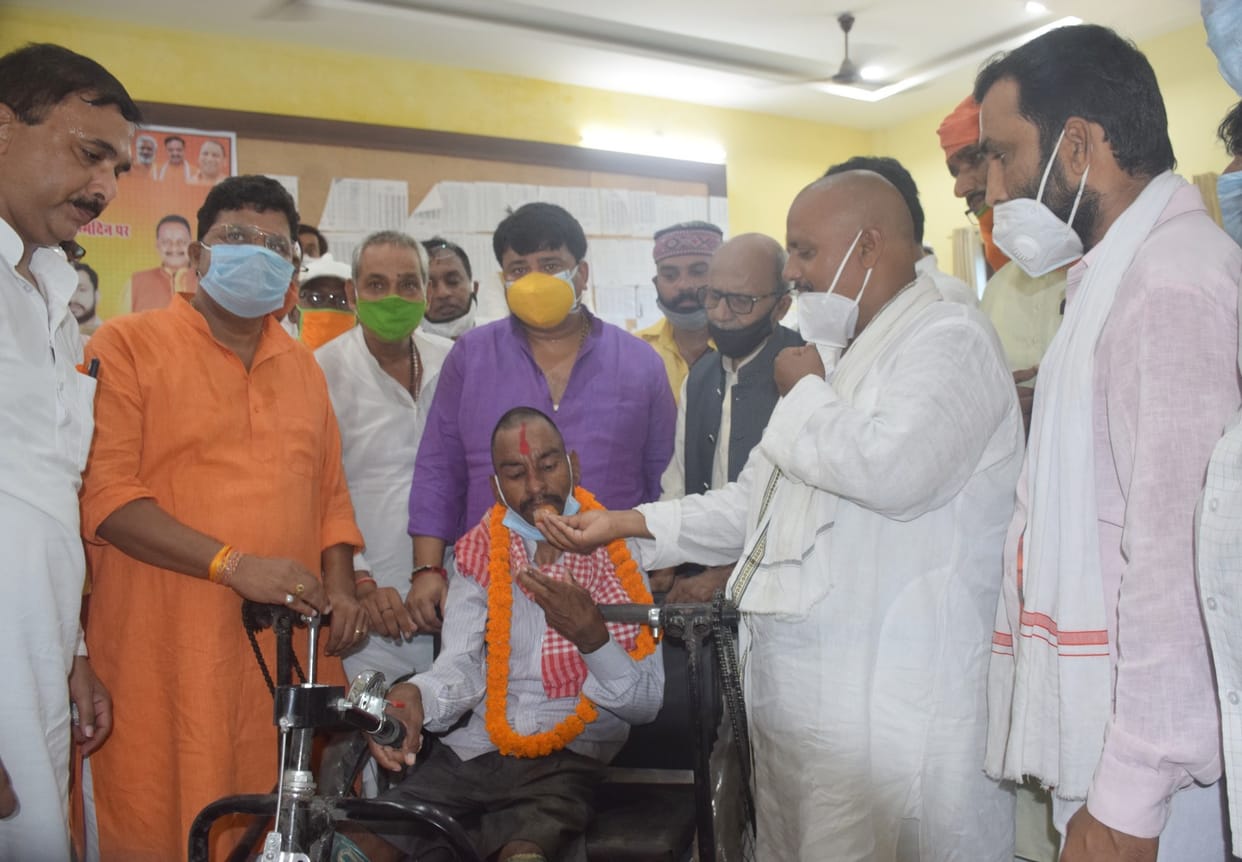 Distribution of fruits and assistive devices to the disabled in patients
