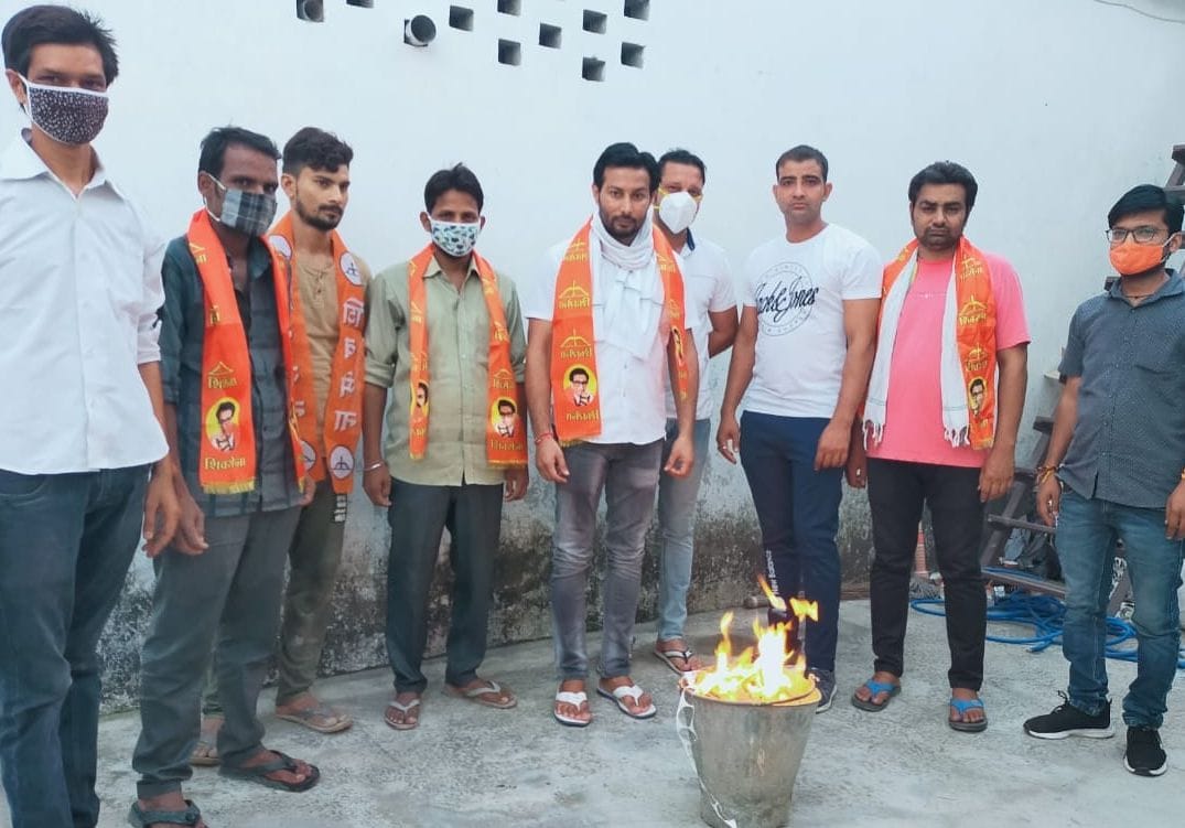 Burning photo copies of degree on unemployed day