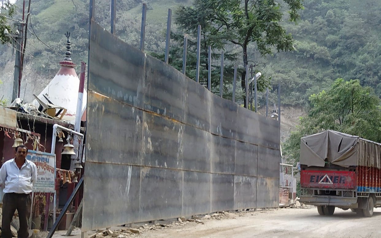 Road widening work started near Gurna temple, the temple covered with iron sheets