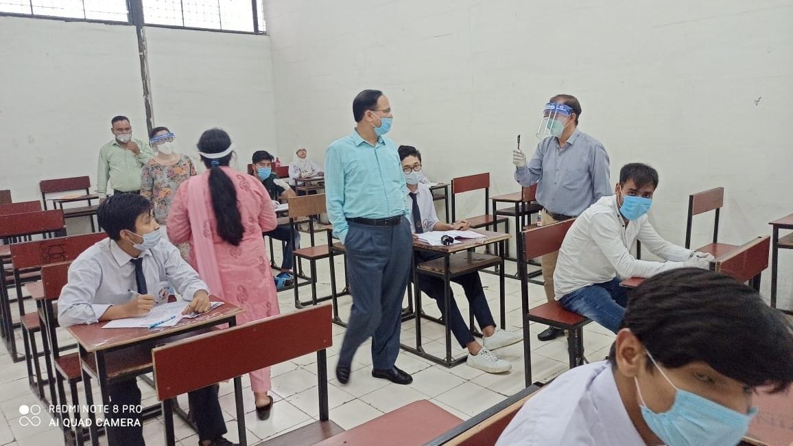 Two university students are giving exams in the same room