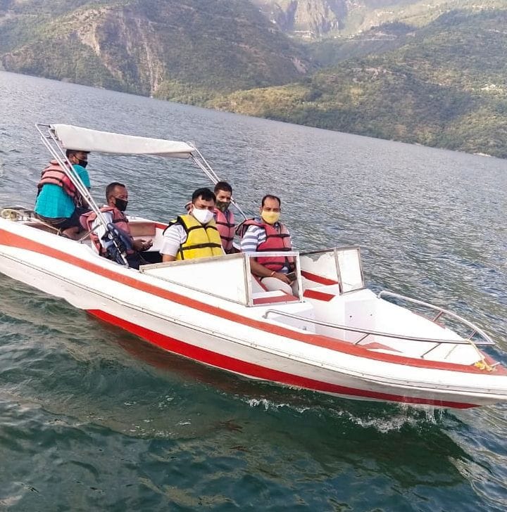 70 tourists ride a boat in tehri