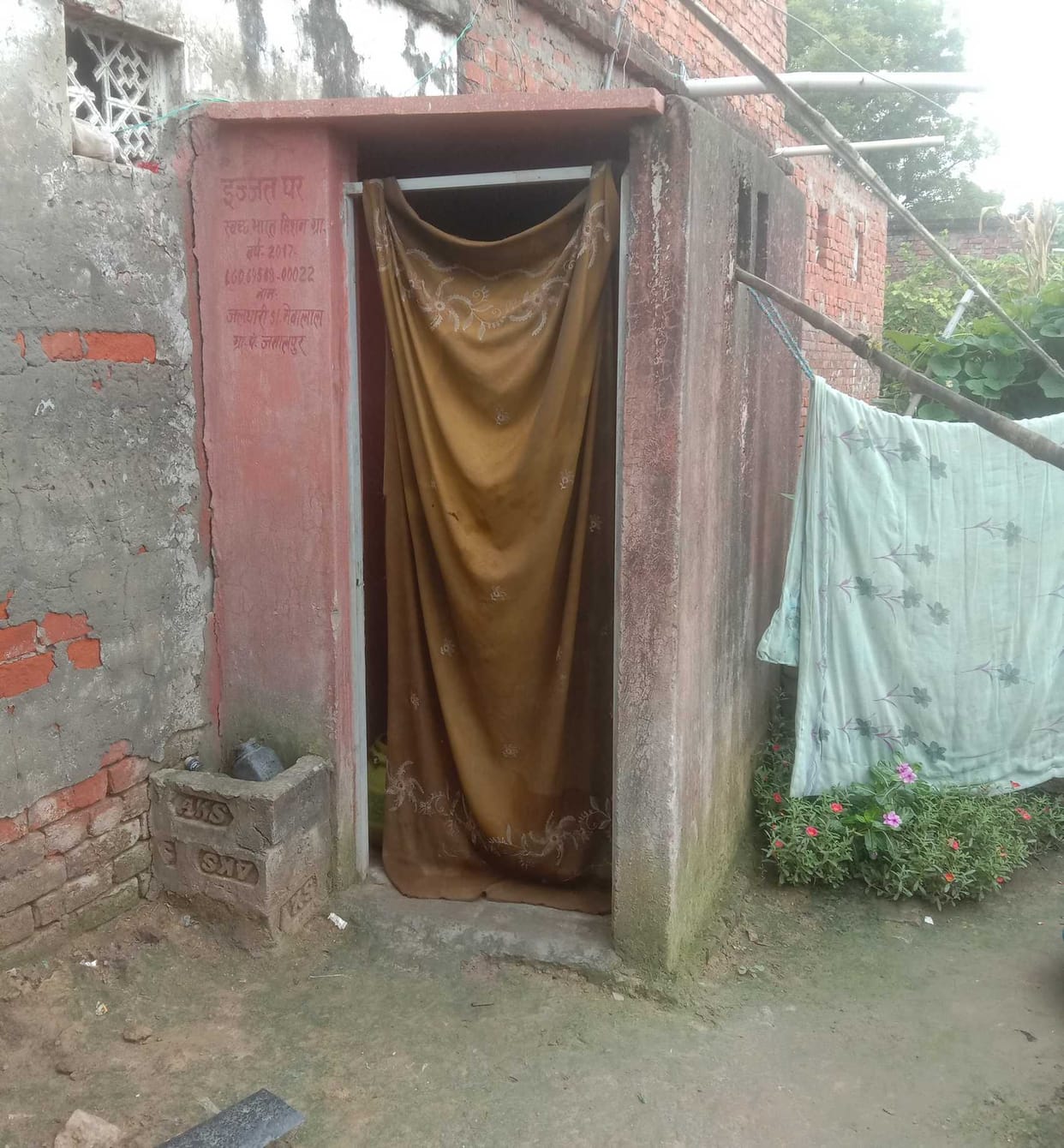 The curtain is being placed somewhere in the toilet instead of the door