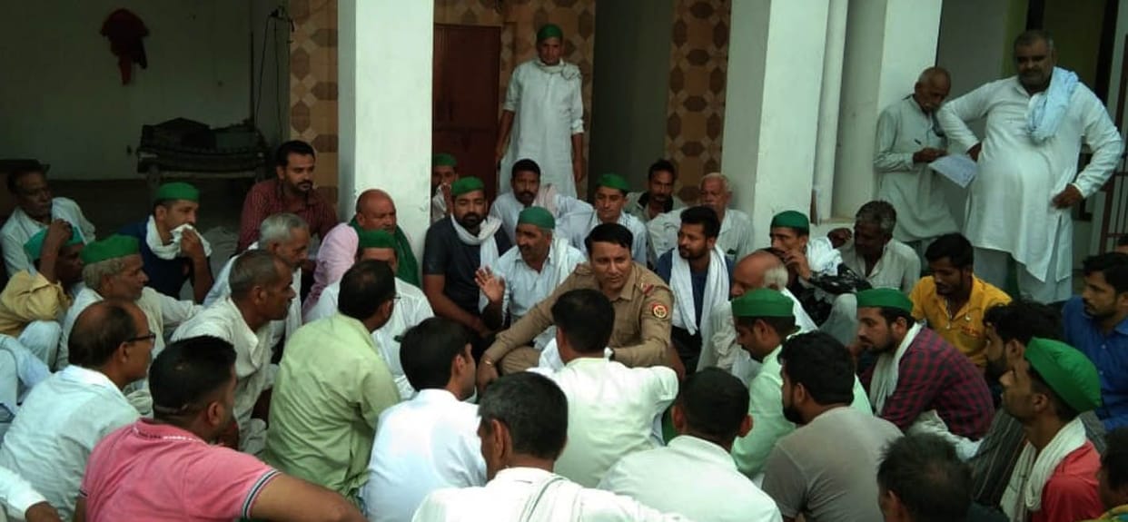 Villagers picket to make way for village