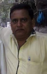 A villager dies due to being buried under a fallen tree during the rains