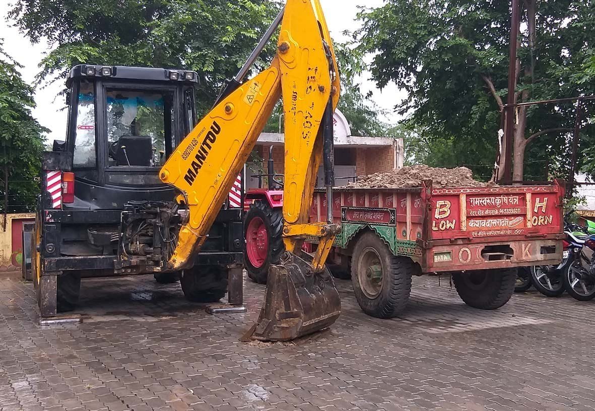 JCB and tractor caught while doing soil mining