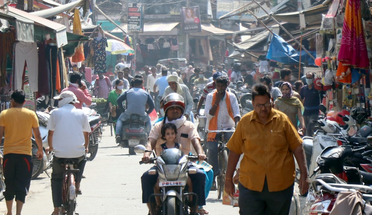 Increased crowds on the streets, masks disappearing from faces