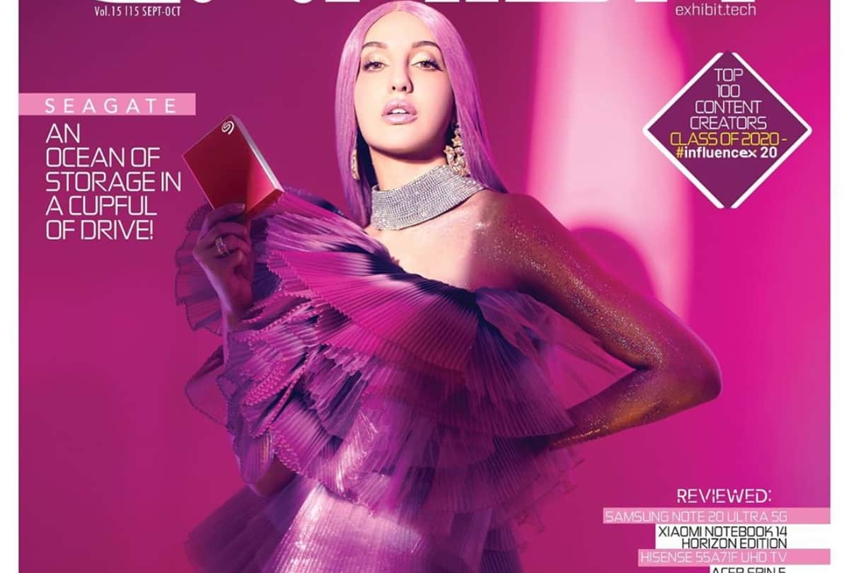 nora fatehi latest photoshoot bold look in purple hair