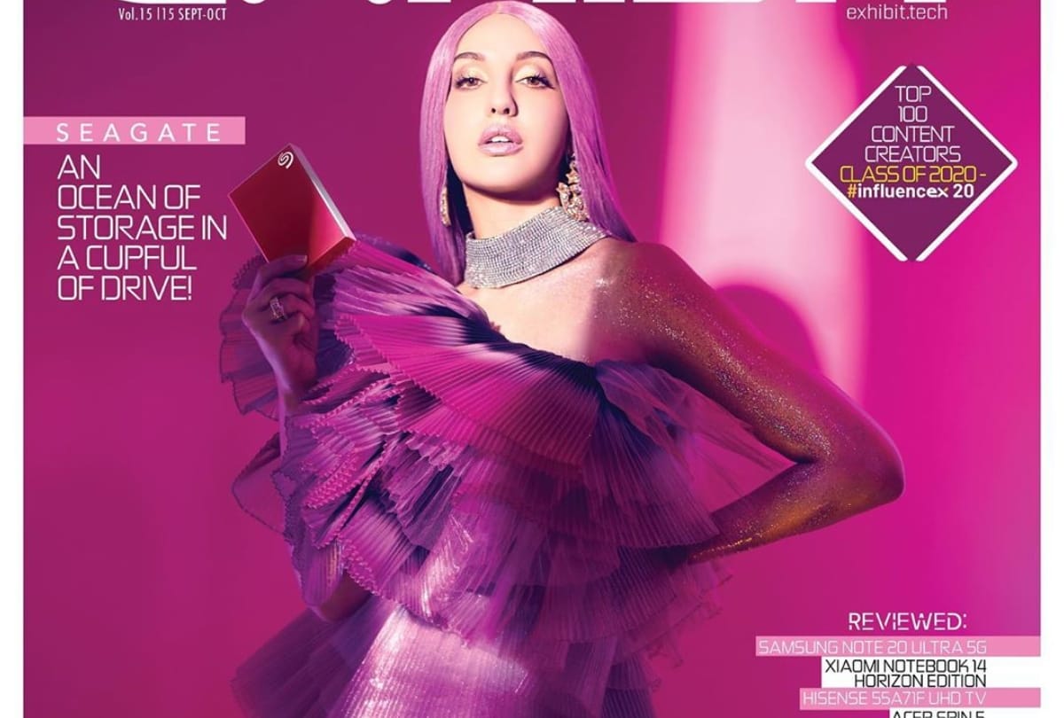 nora fatehi latest photoshoot bold look in purple hair