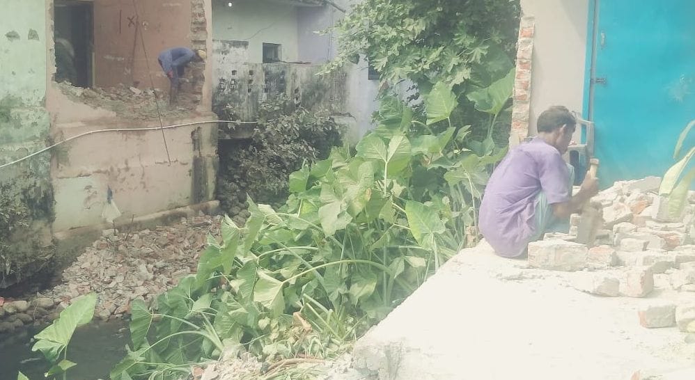 People trying to remove encroachment from the Entha drain