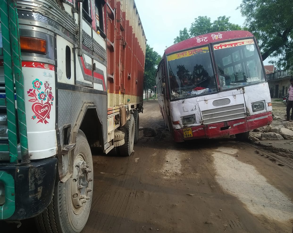 The condition of the road is such that vehicles are being removed from JCB