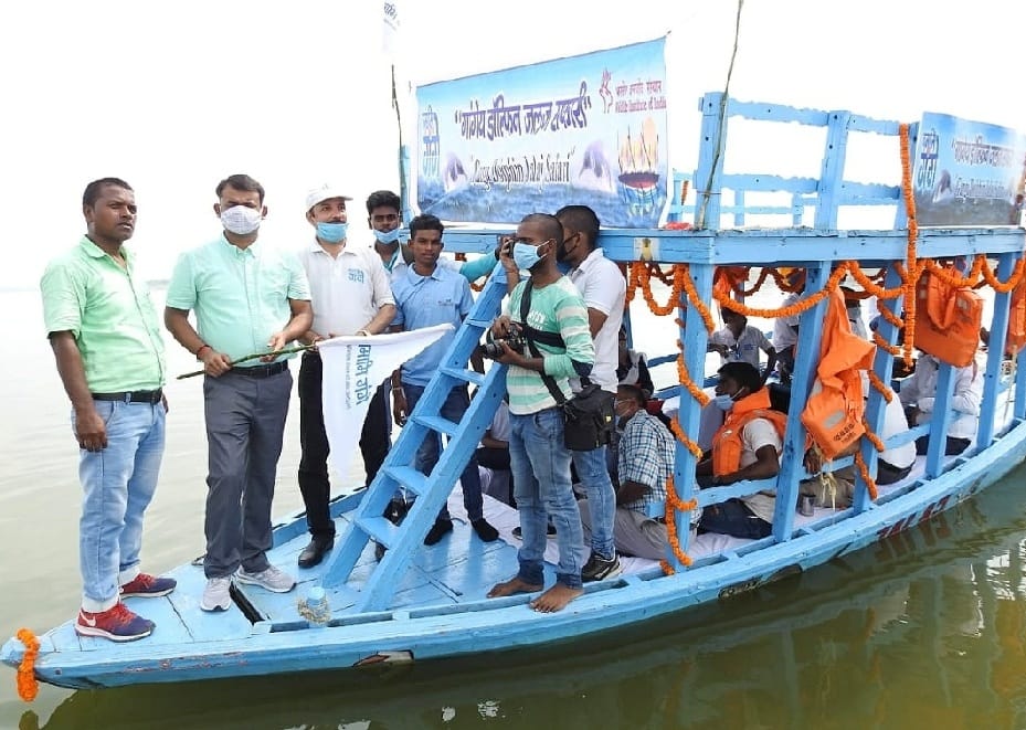 Dolphin in Ganga tourists enjoy habitat in Varanasi dolphin safari employment for sailors