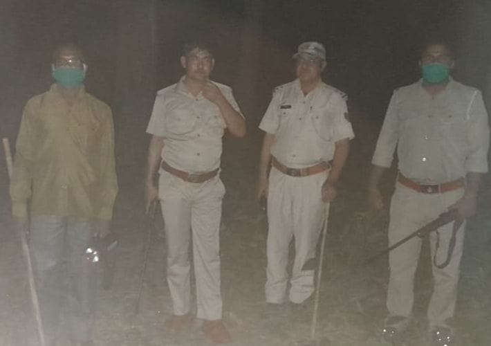 Forest personnel take stock of the protection of wildlife in the forest adjacent to Nepal at night