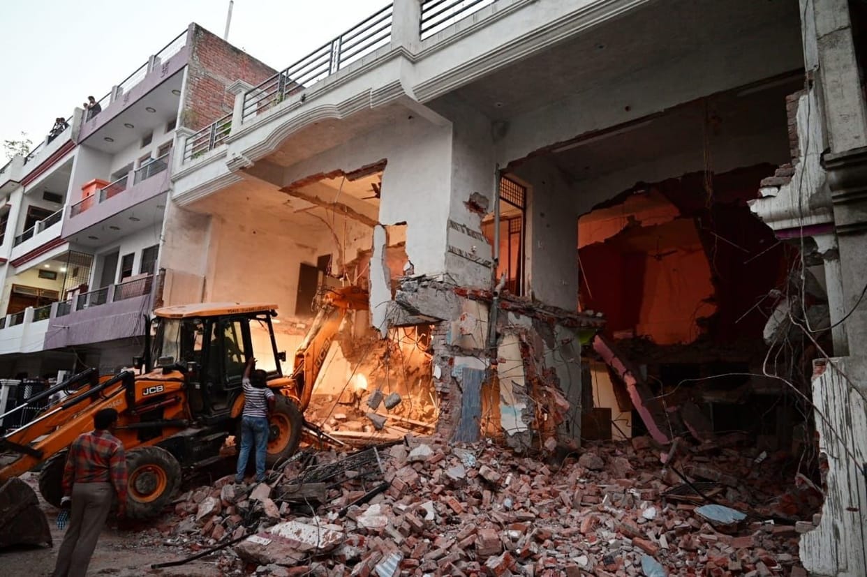 pda's bulldozer is ready to demolish illegal construction at cooper road