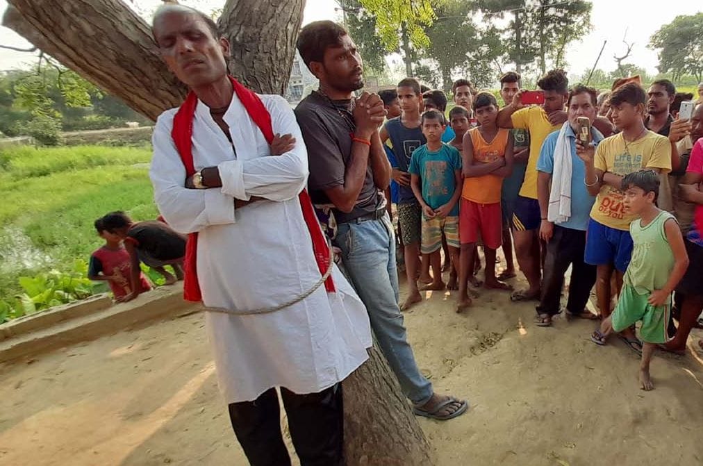 Villagers held hostage by committing liquor at the door of another