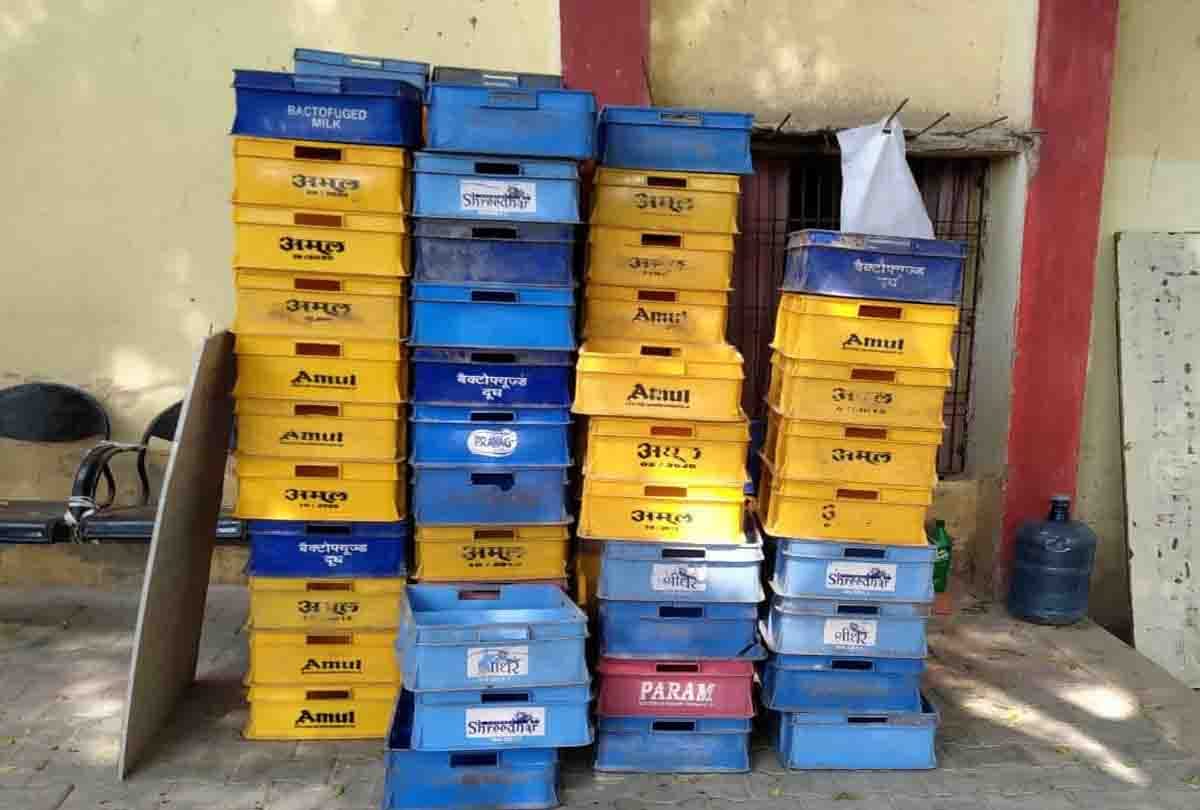 Desi liquor kept in boxes in milk vehicle