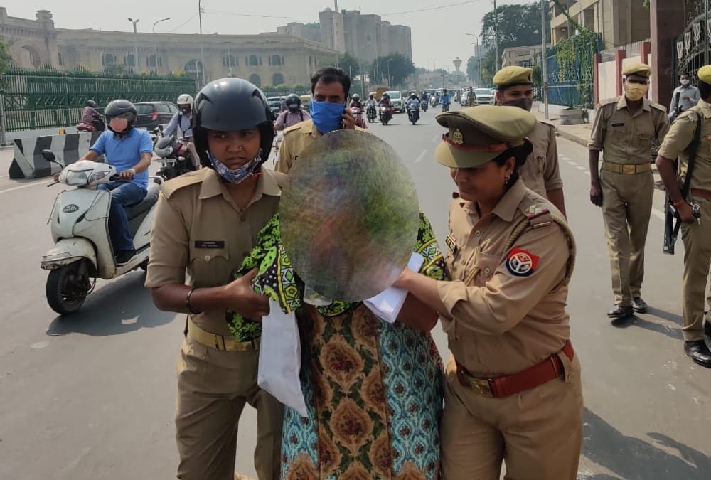 A woman tales sleeping pills in front of Vidhansabha in Lucknow.