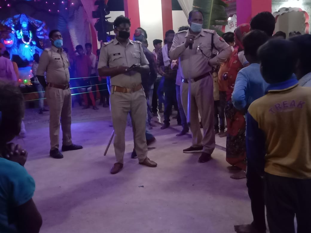 policer offider suspended for shoes in pandal