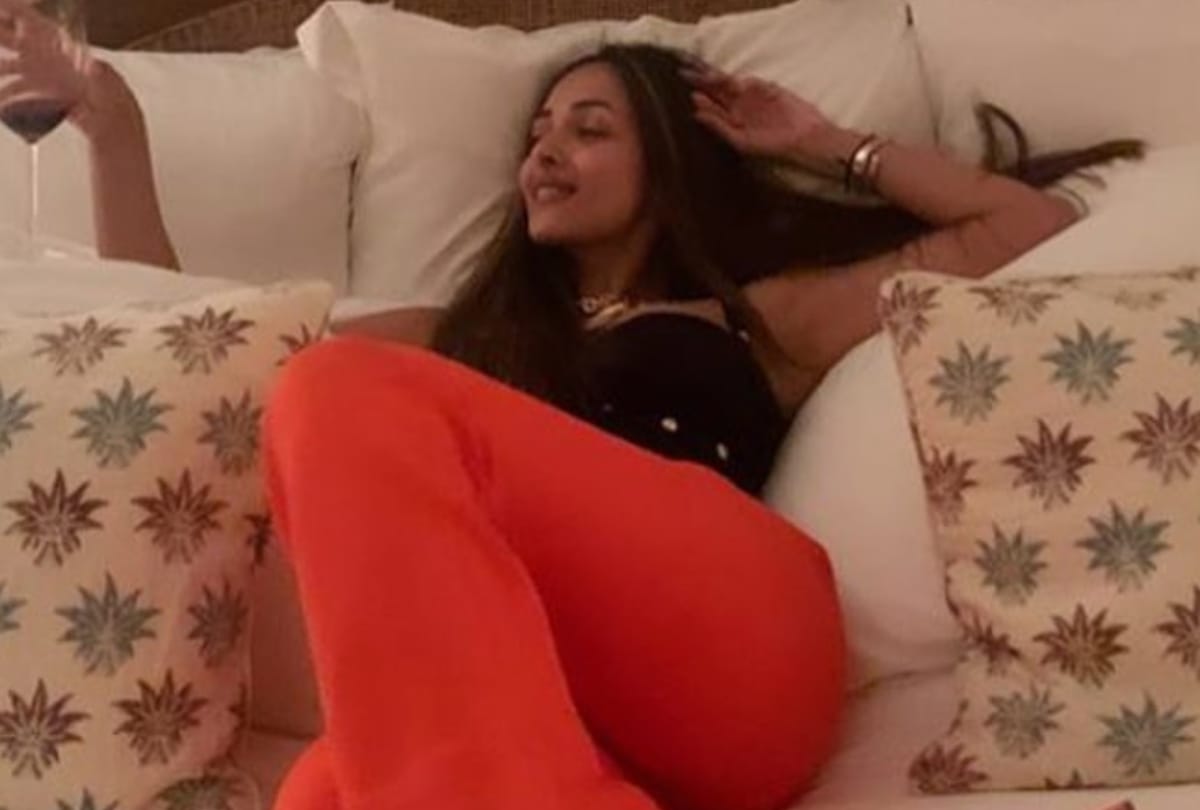 malaika arora birthday celebration in bright orange pant suit with black bustier