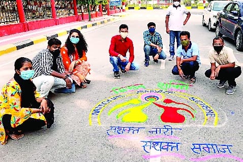 Rangoli message of 'Strong women-strong society'