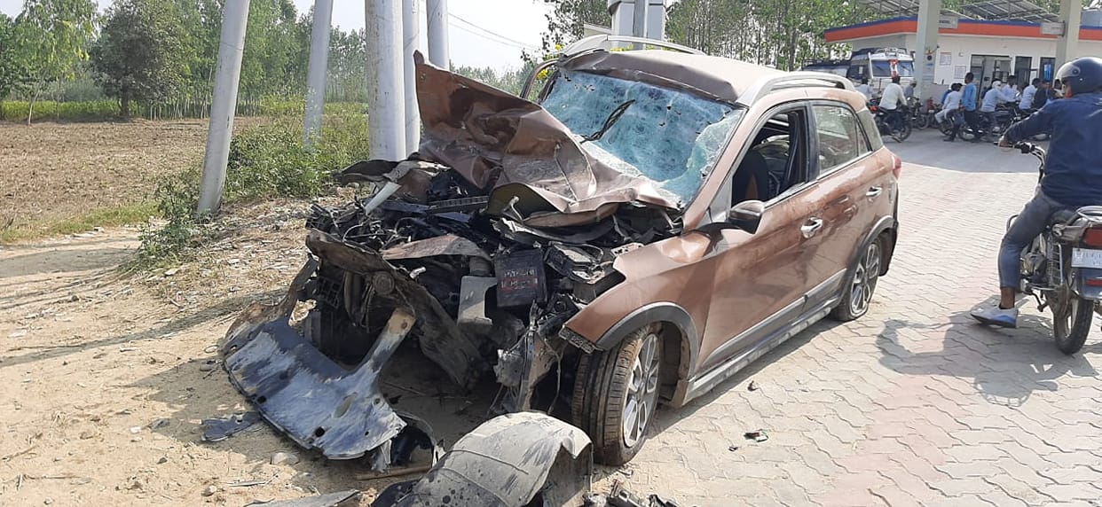 Car collides with a standing truck, two killed