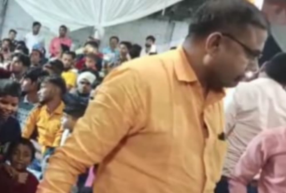 Officers dance with bar girls in Bahraich.