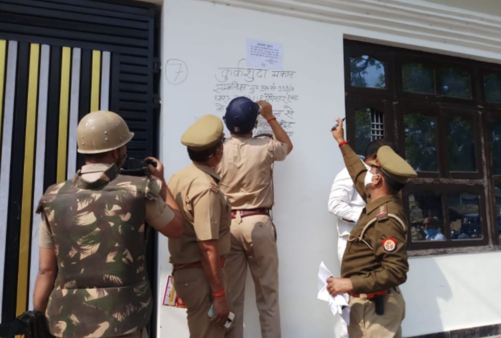 Police sealed the home of village pradhan for being alleged in crime cases.