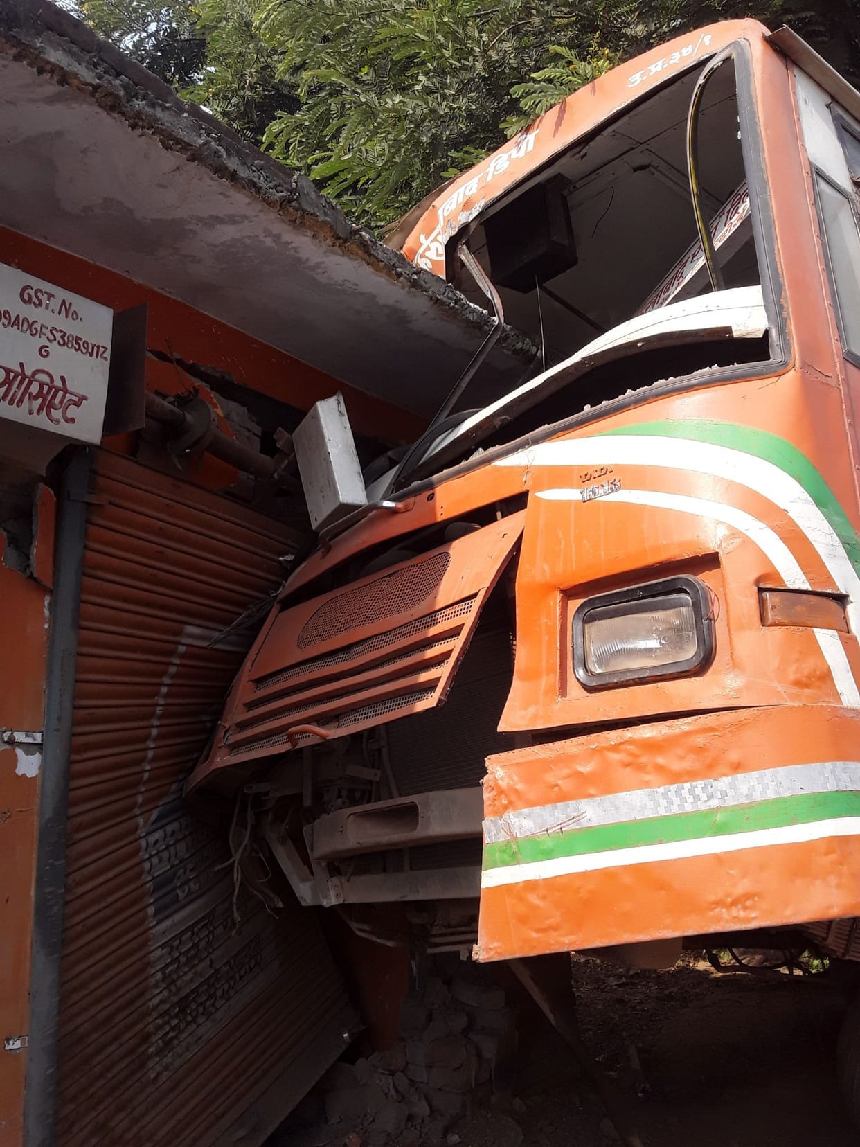 Roadways bus entered into shop, two injured