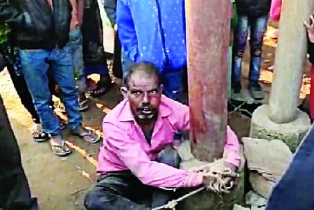 Mentally weak youth tied to a pole and beaten