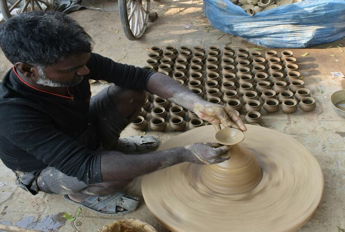 blind potter naresh making diyas for Diwali 2021 in agra