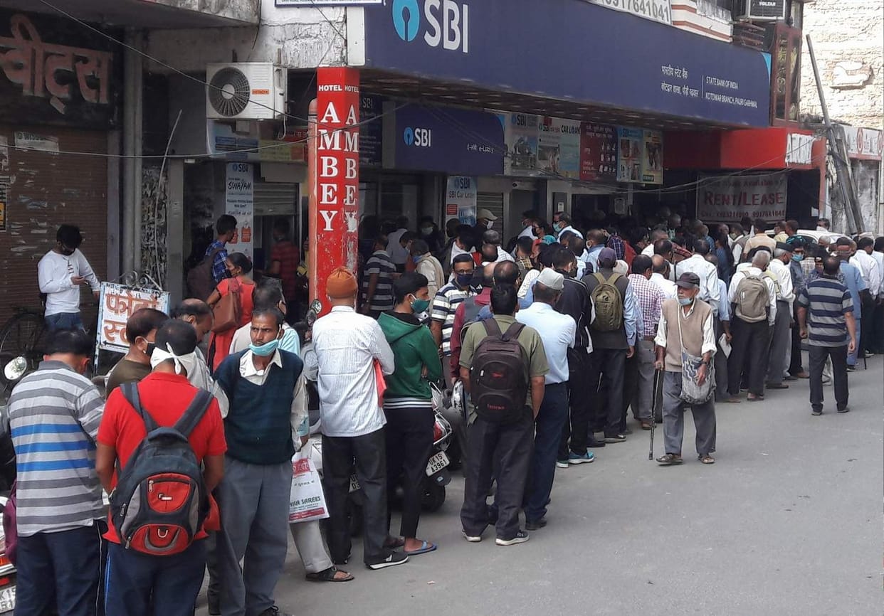 Forget social distancing, crowds in ATMs and markets