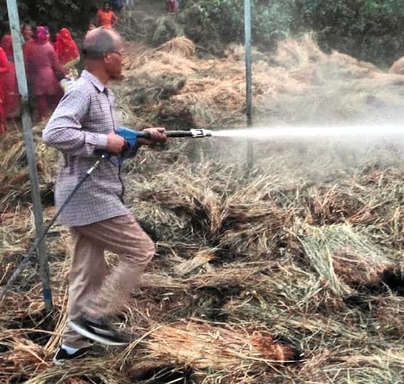 Fire team extinguished the fire in a pile of grass