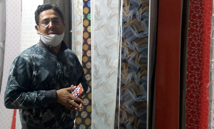 Walls decorating with wallpaper painting for Diwali